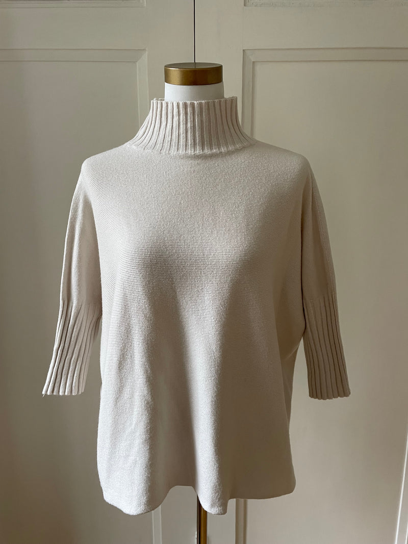 Feinstrickpullover stehkragen gerippte ärmel beige