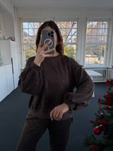 Oversized Oberteil mit Glitzer und Ballonärmeln, kürzer vorne, länger hinten – Gr. 36-42 braun